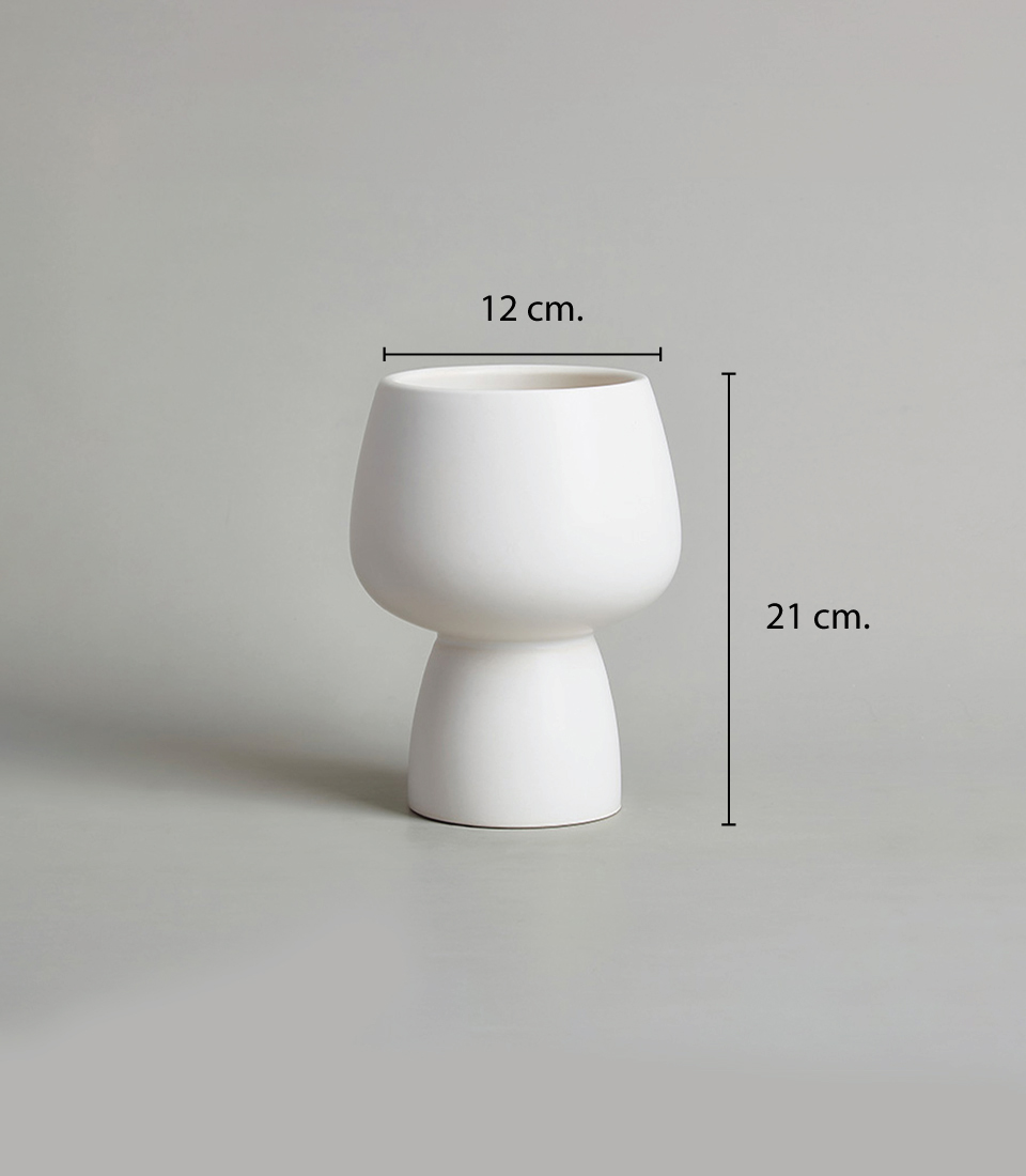 Modern white ceramic vase with a minimalist design, featuring a rounded bowl-shaped top and a narrow base it measures 12 cm in width and 21 cm in height.