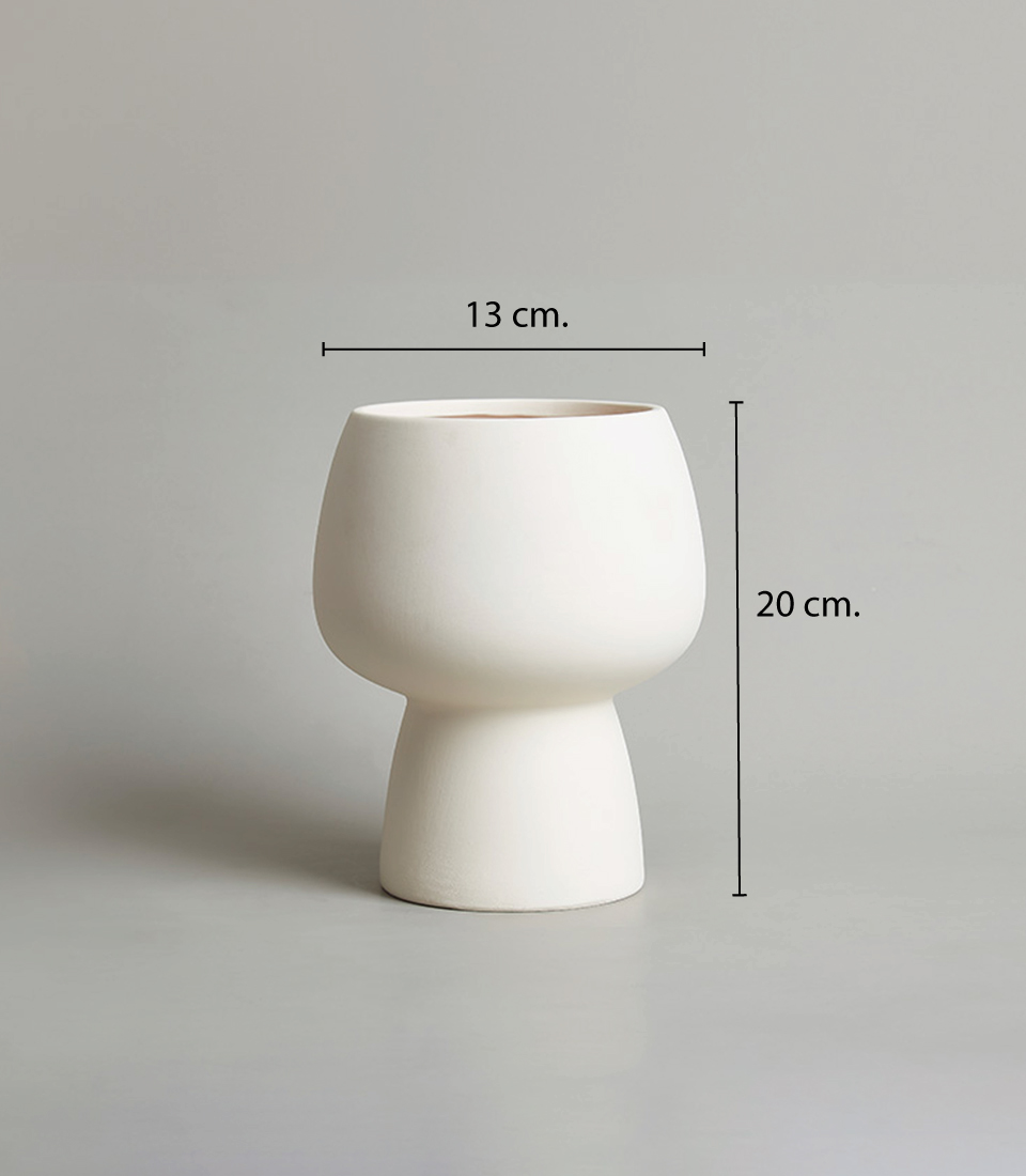 Minimalist white ceramic vase with dimensions 13 cm in diameter and 20 cm in height. against a neutral background.