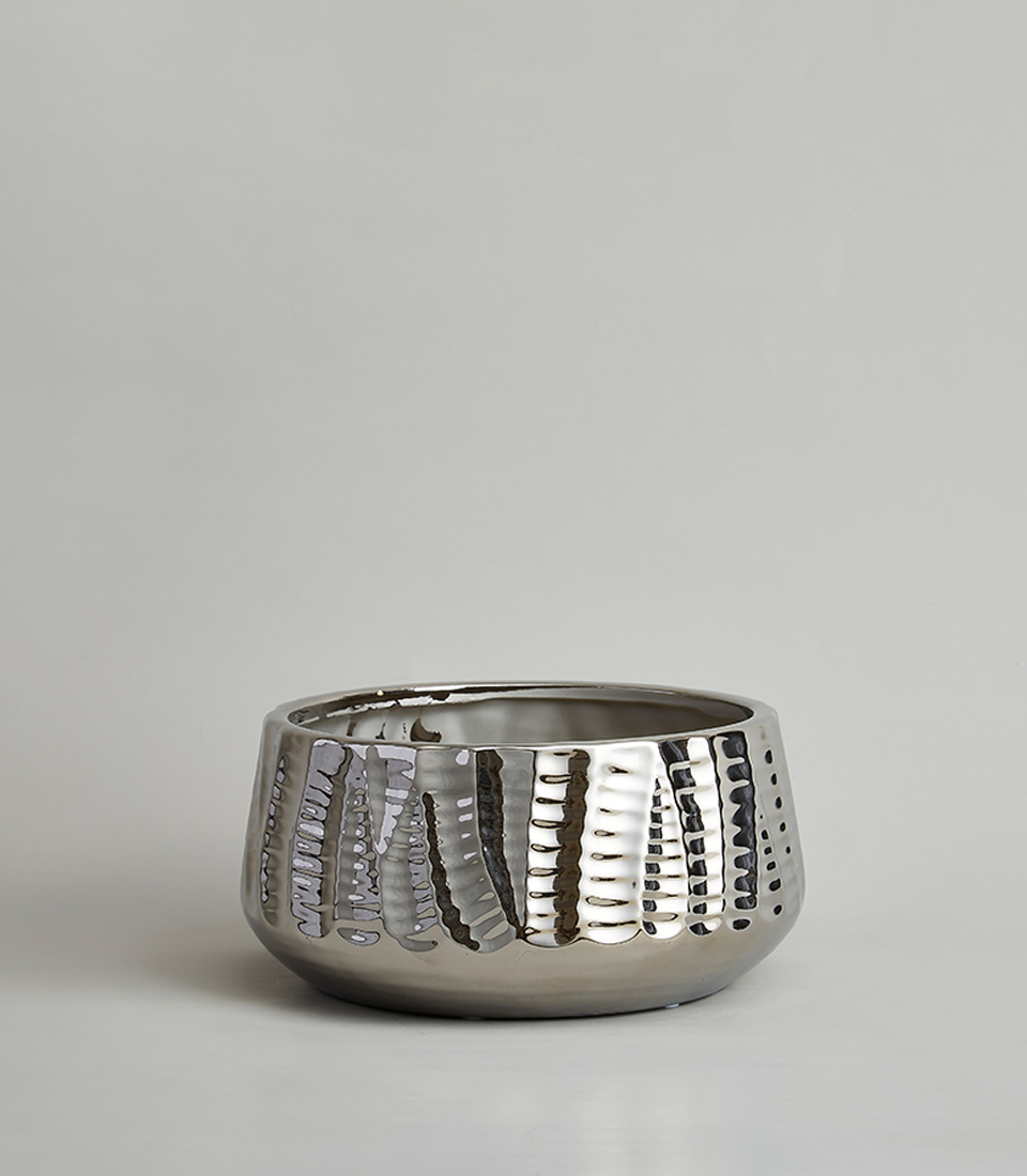Wide round metallic silver textured ceramic vase against a neutral background.