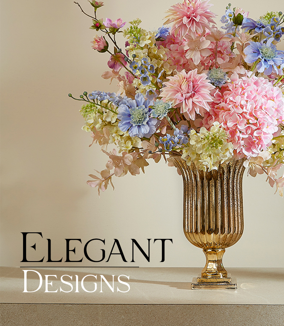Elegant artificial flower arrangement with pink hydrangeas and blue delphiniums in a gold vase with 