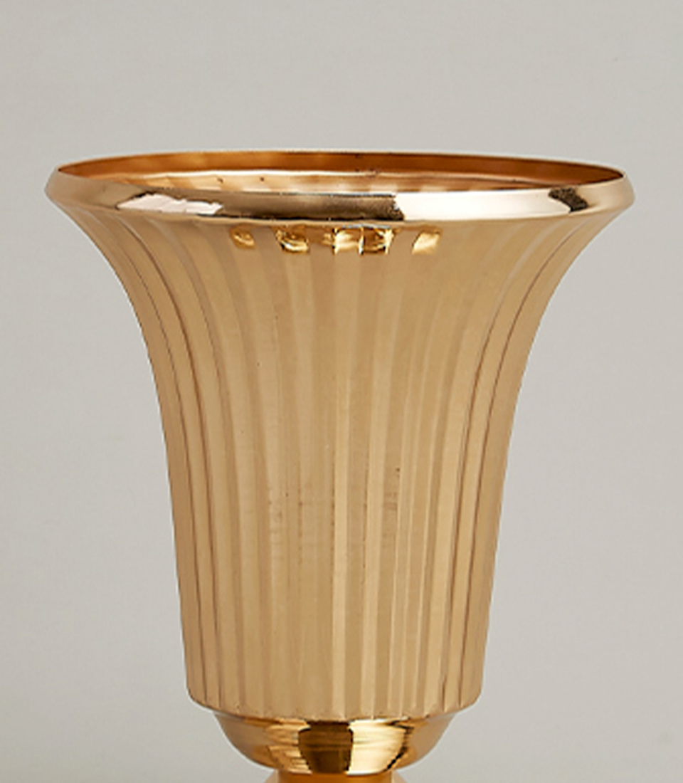 Close-up view of Elegant gold-plated stainless steel vase with a modern fluted design.