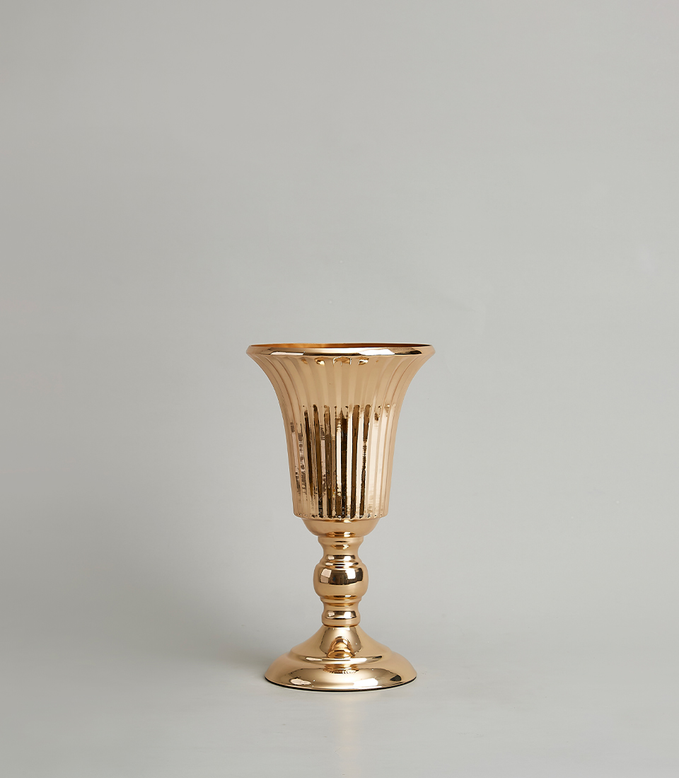 Elegant gold-plated stainless steel vase with a fluted design, on a light grey background.