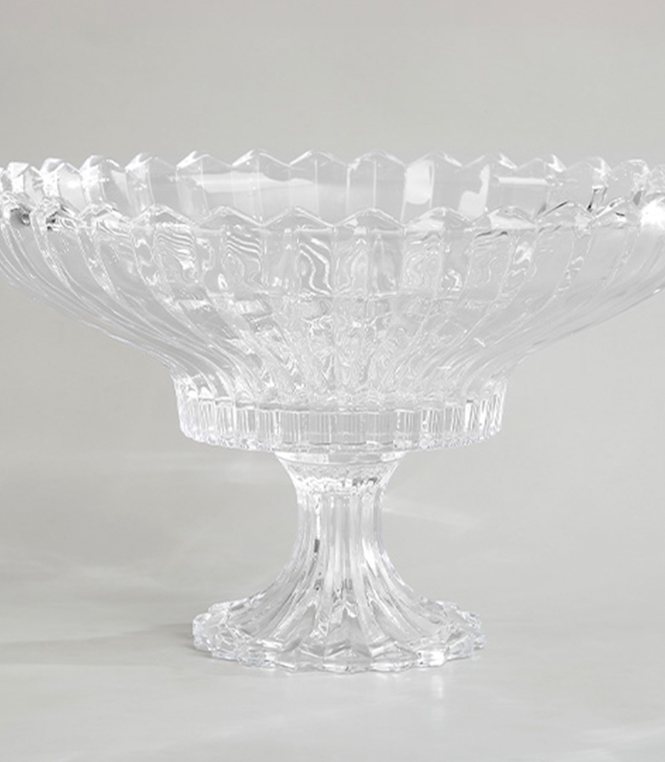 Close-up of Elegant mirrored glass vase with reflective surface and intricate design, on a light grey background.