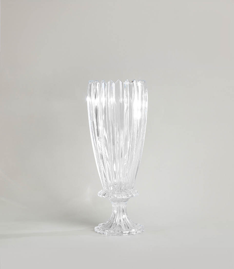 Tall crystal glass mirror vase with intricate faceted design on a white background.