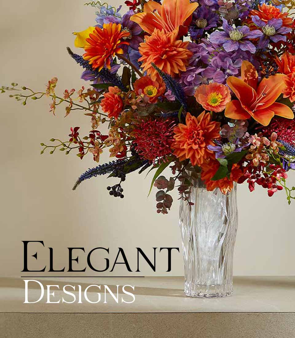 Elegant artificial flower arrangement in a clear textured vase with vibrant orange and purple flowers, featuring the text 
