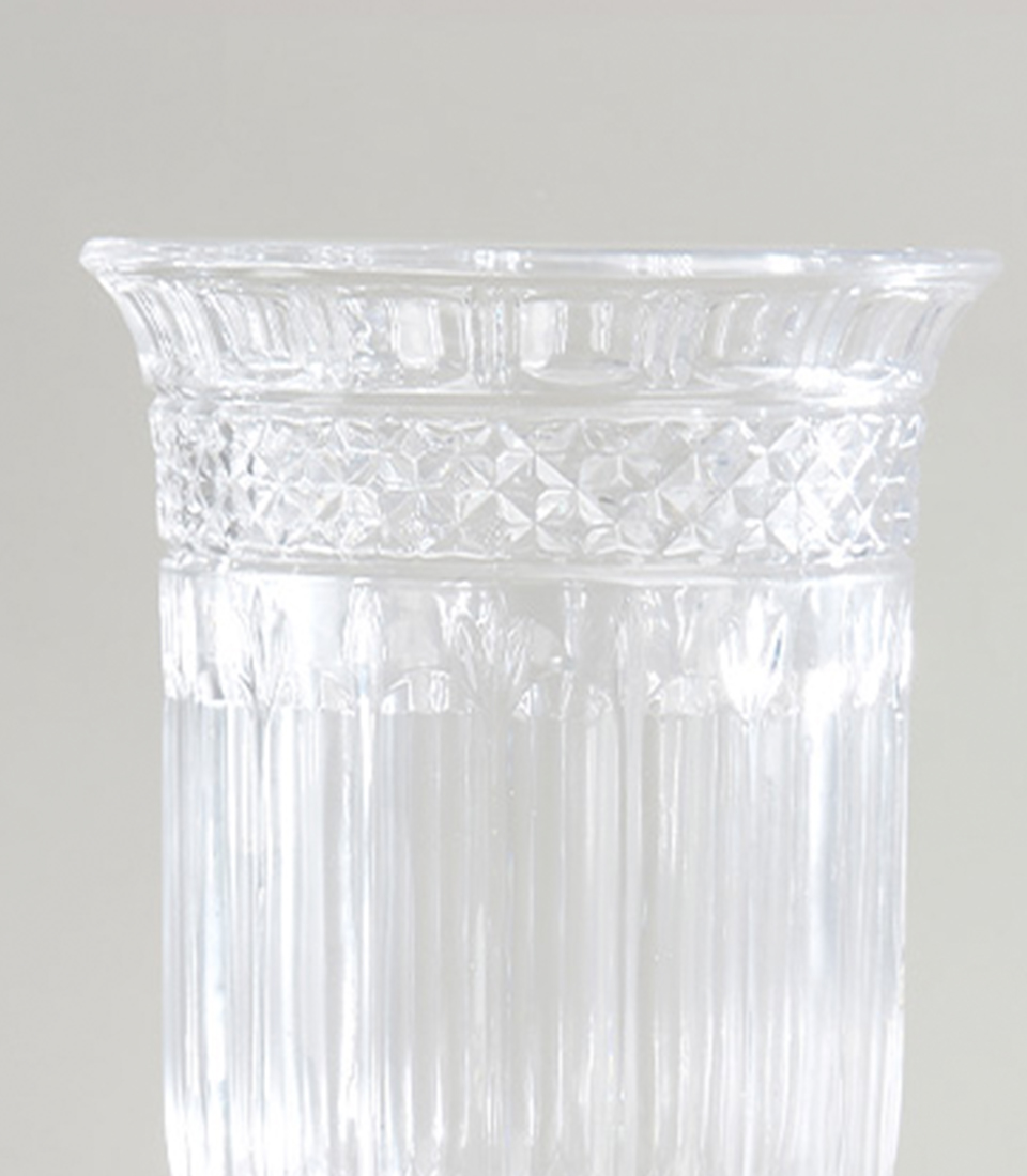Close-up view of the intricate diamond pattern and fluted design on an elegant crystal vase.