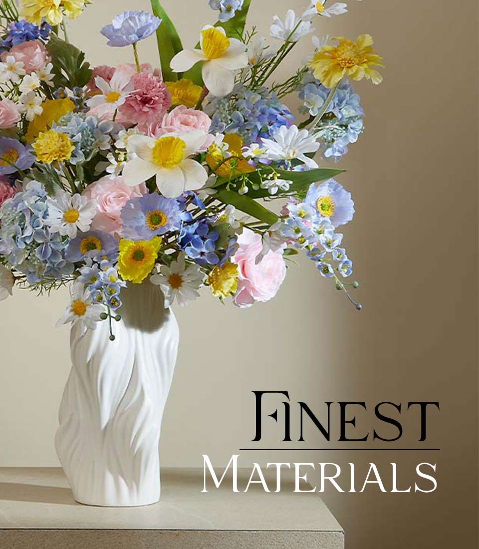 Artificial flower arrangement with pastel-colored daisies, roses, and hydrangeas in a sleek white vase, displayed on a beige background with text 