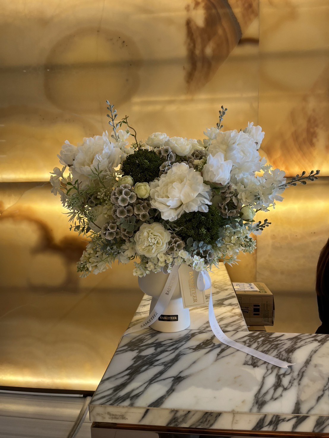 Snow-Kissed Serenity artificial vase with white and green peonies and hydrangeas, ribbon-adorned, on marble; luxury Bangkok delivery.