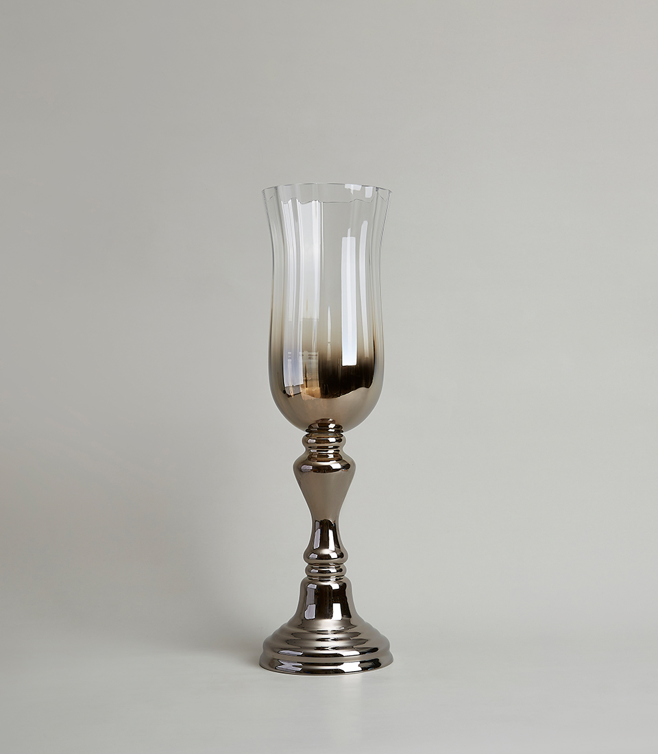 Tall ombre silver glass vase with a pedestal base, featuring a sleek reflective finish transitioning to a smoky gradient, on a light gray background.