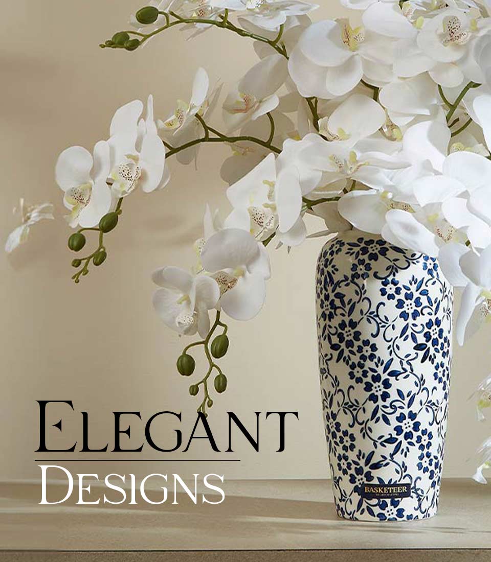 Close-up of Artificial white orchids in a blue and white ceramic vase with floral patterns, with a 