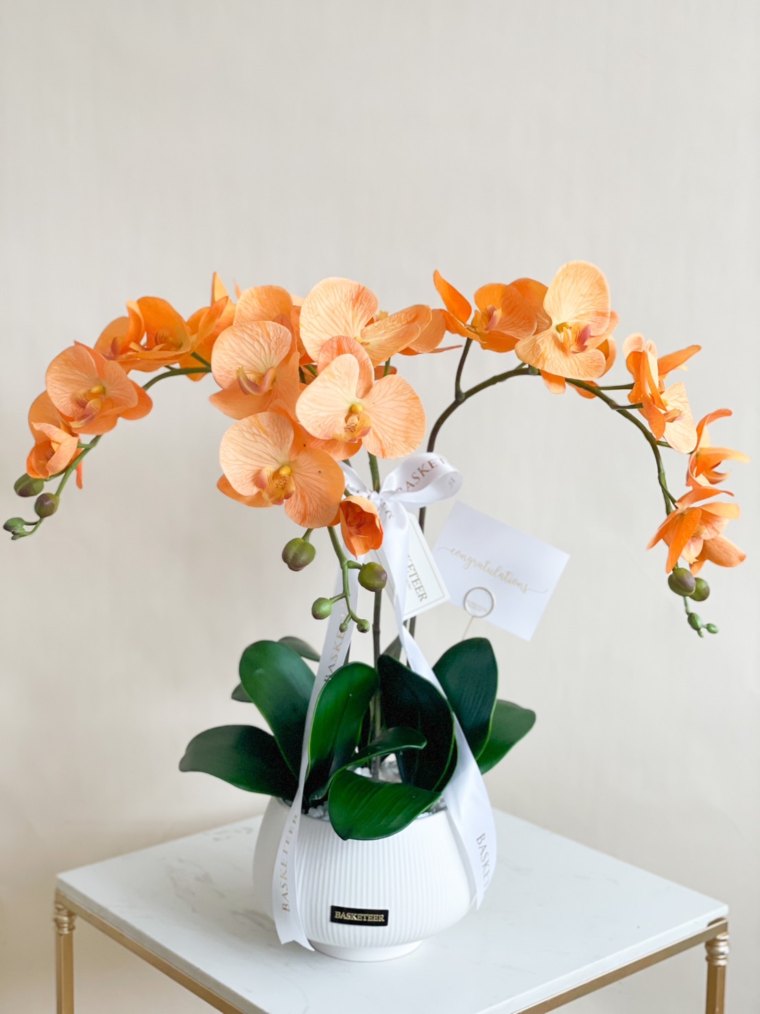 Golden Sunrise Phalaenopsis Orchid in a white pot, standing at 57 cm, with vibrant yellow blooms and subtle red accents