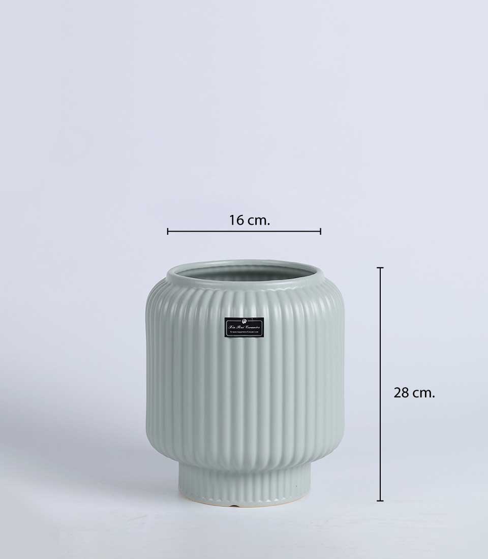 Light green ribbed ceramic vase with elevated base and dimensions indicated: 16 cm diameter and 28 cm height.