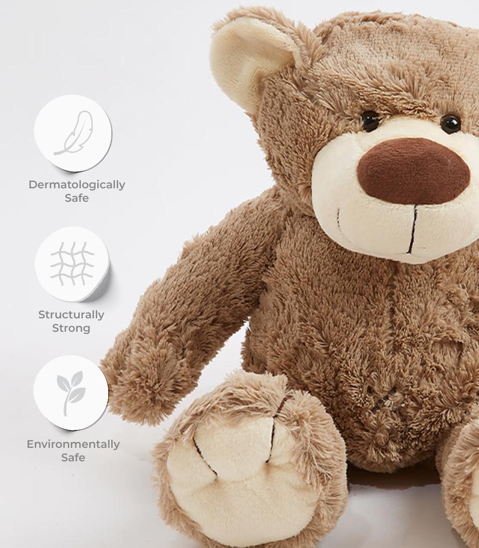Close-up of a soft and cuddly brown teddy bear plush toy, highlighting its dermatologically safe, structurally strong, and environmentally safe features.