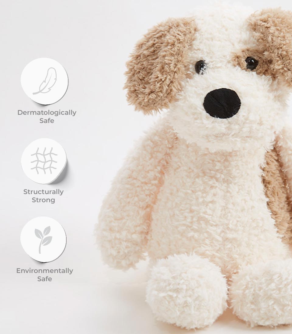 Close-up of a cute beige and brown plush puppy toy with dermatologically safe, structurally strong, and environmentally safe icons