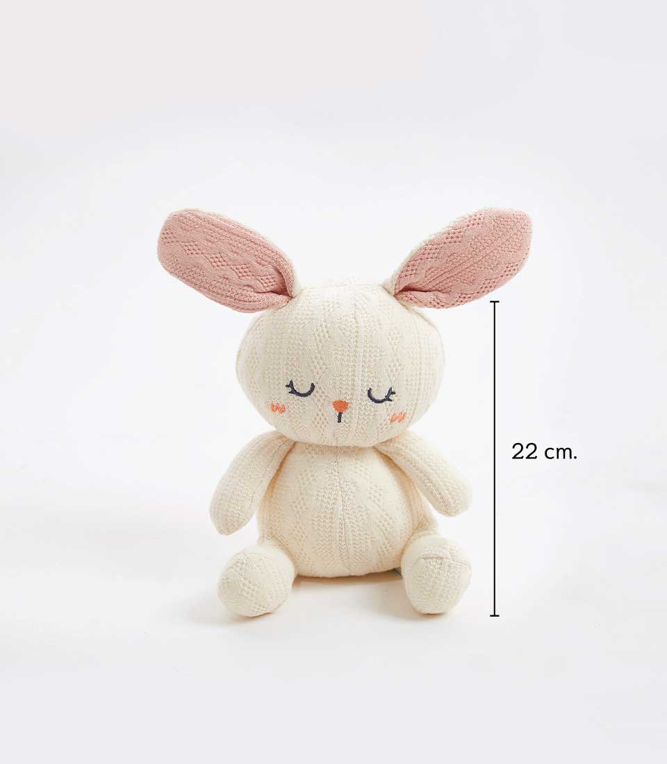 Handcrafted crocheted bunny plush toy, 22 cm tall, with a soft cream exterior and pastel pink ears. The bunny has a sweet, sleepy face with embroidered eyes and an orange nose, perfect for newborns and young children.