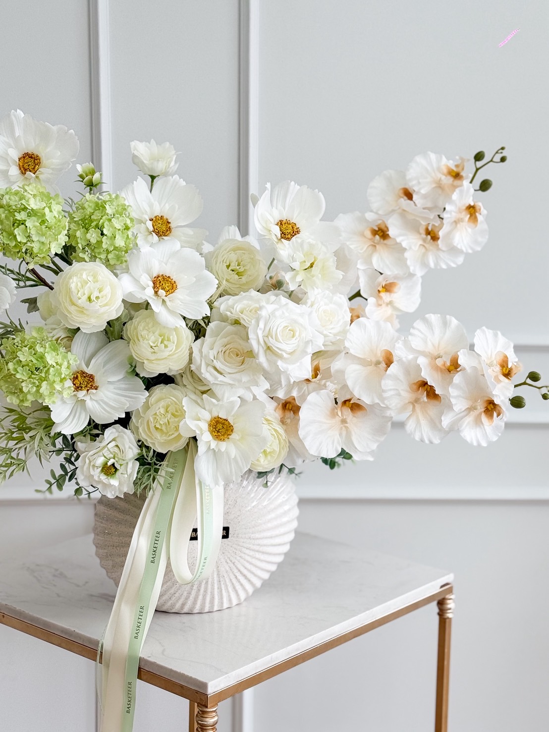 Luxury white flower vase arrangement with orchids, garden roses, and hydrangeas, accented with greenery, perfect for elegant gifts or decor