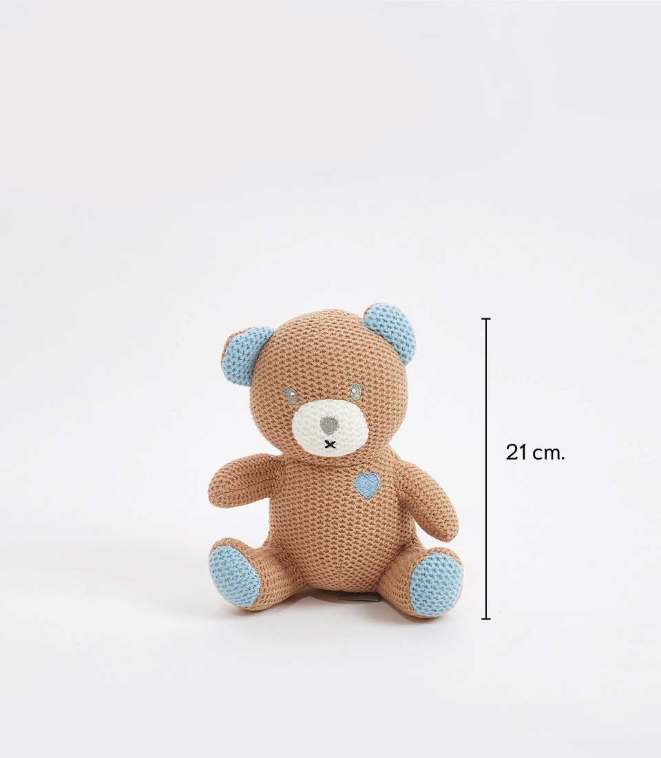 21 cm brown crocheted teddy bear with blue accents on its ears, paws, and a blue heart detail on its chest, sitting against a plain background.