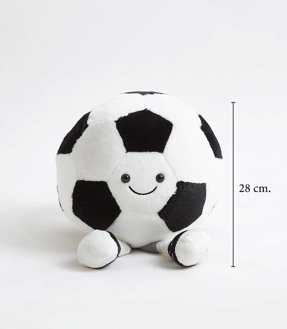 A plush toy resembling a soccer ball with black and white patches. The toy has a smiling face with two eyes on one of the white patches. It has small, plush feet at the bottom. A label to the side indicates the toy is 28 cm in height.