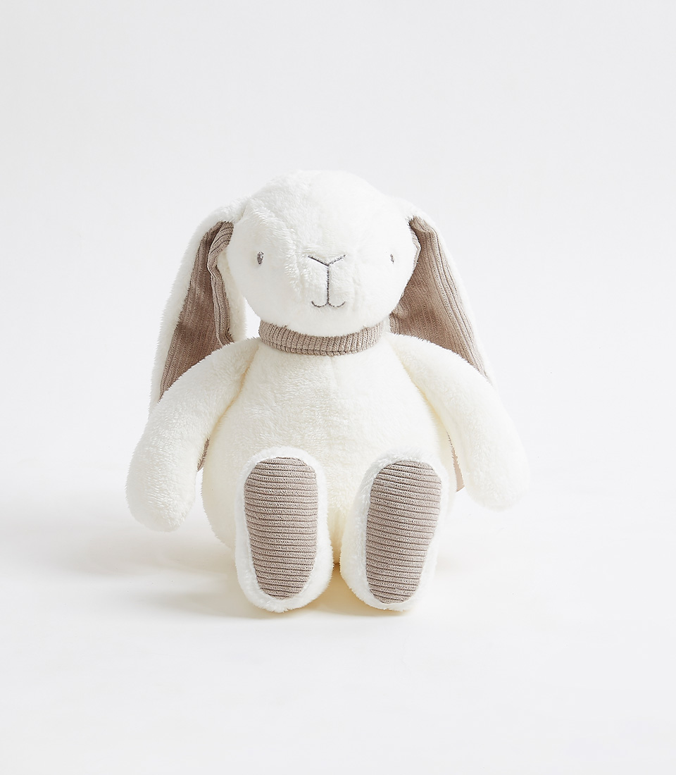 A plush toy rabbit with a white body, floppy ears, and gray accents on its inner ears, paws, and nose. It has a simple stitched face and is sitting upright against a white background.