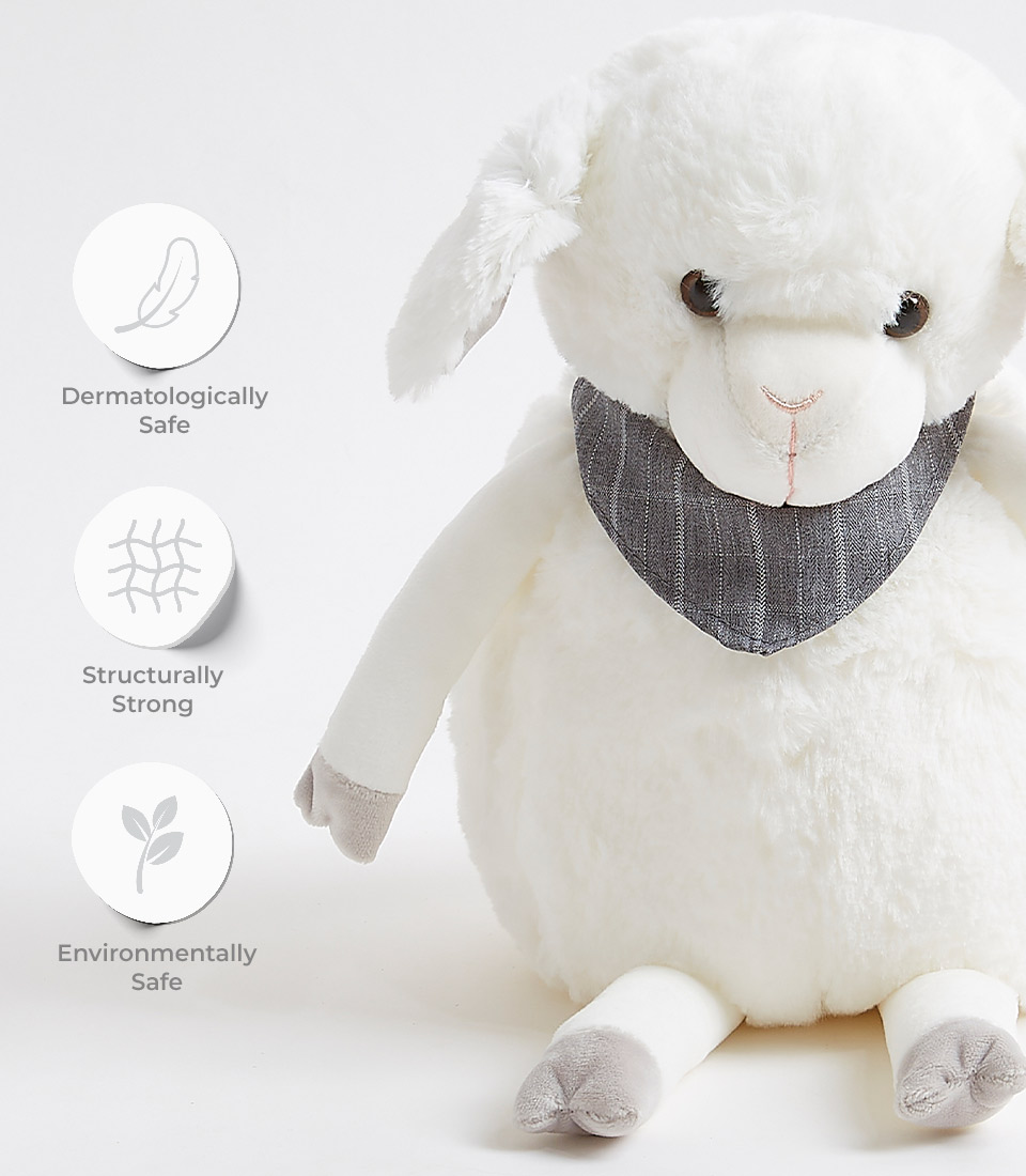 A soft, plush Fluffy Sheep Soft Toy with a grey scarf. Three circular icons on the left side indicate features: a feather with 
