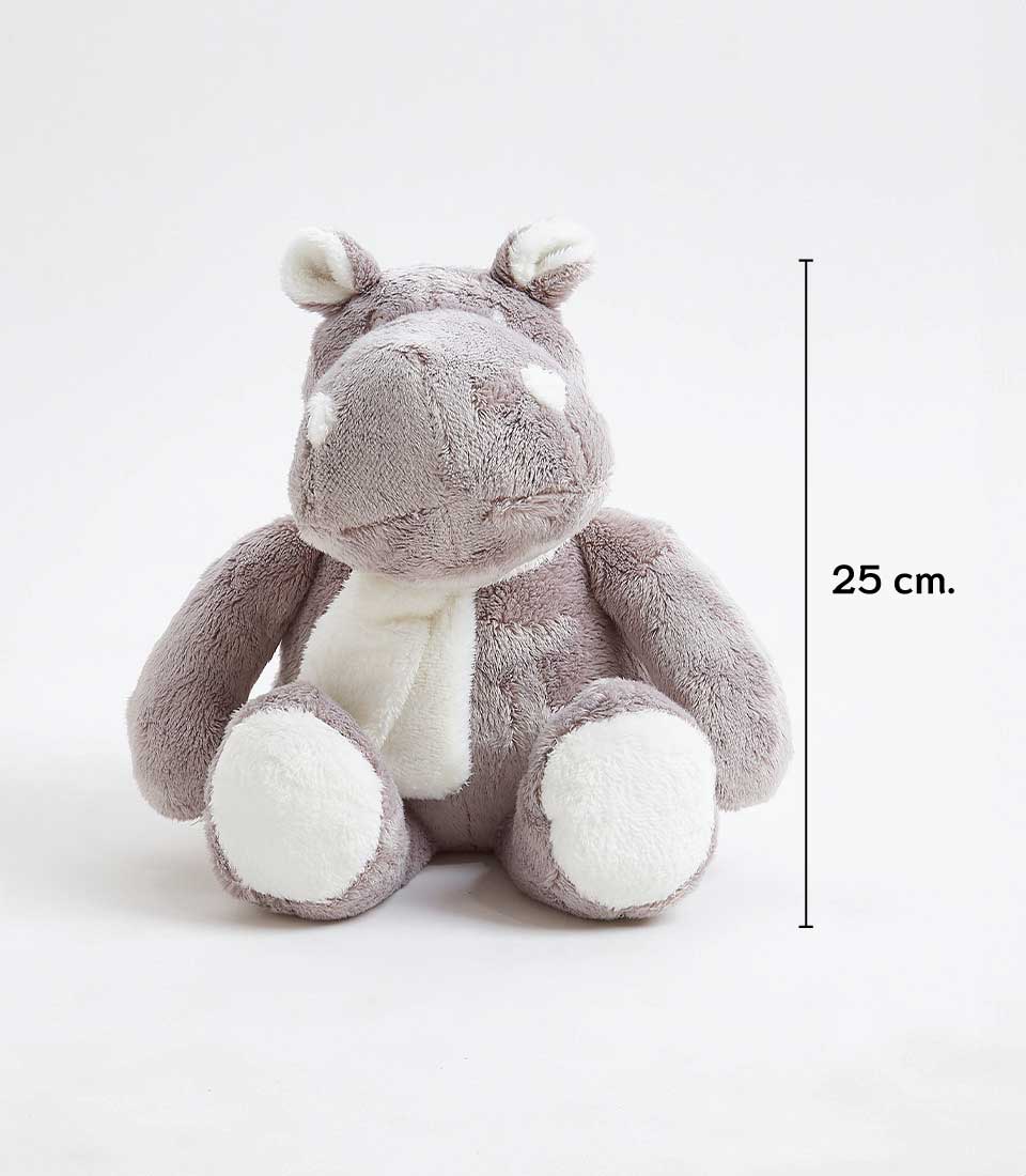 A cuddly grey and white plush hippo toy is sitting upright against a plain white background. It measures 25 cm in height, as indicated by a line with the measurement next to it. This soft toy hippo has small ears, rounded features, and is wearing a white scarf.