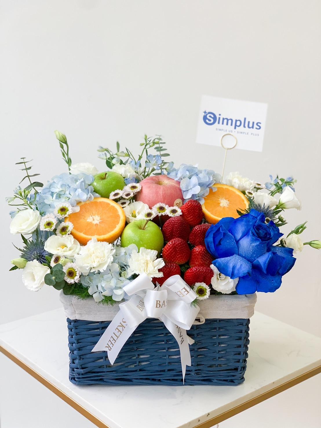 A beautifully arranged blue wicker basket, aptly named the 