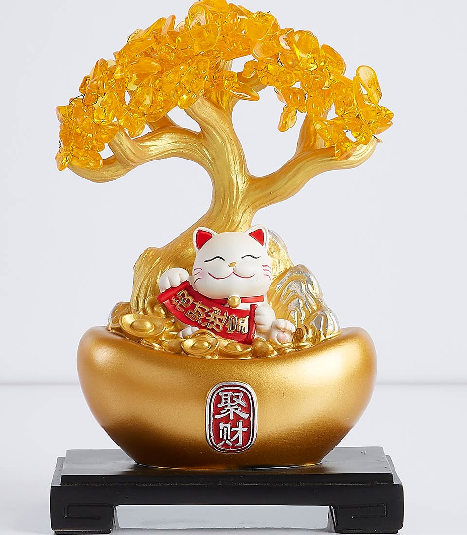 Golden money tree with crystal-like leaves and a white Maneki-neko cat sitting on a gold coin base.
