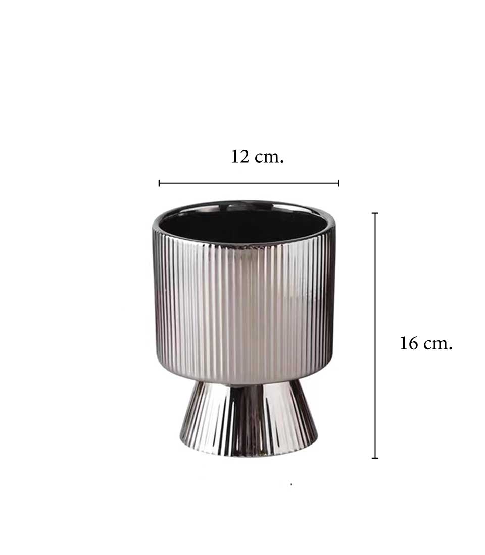 Sleek silver ceramic planter with ribbed texture and flared base.