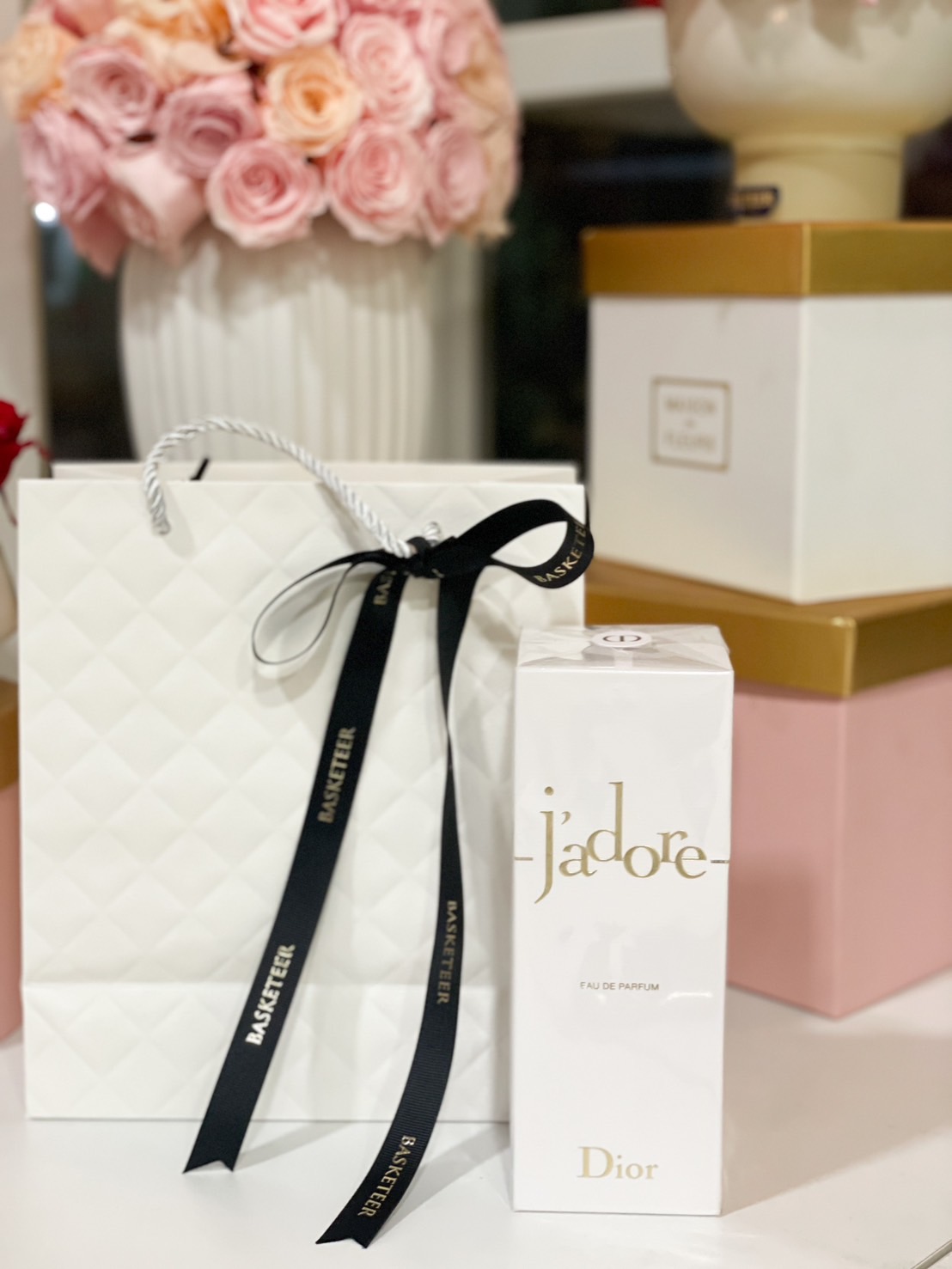 A J'adore by Dior Perfume Gift Set elegantly wrapped in a luxury Basketeer gift bag with a black ribbon – a perfect luxury fragrance gift for her.