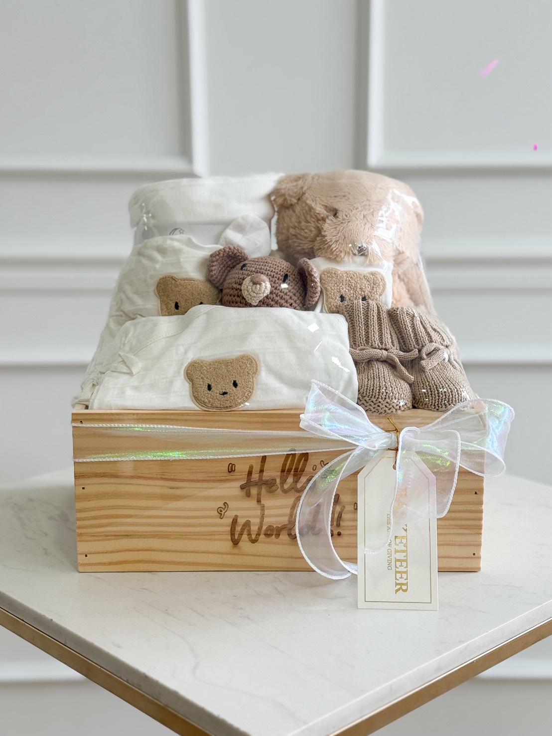 Luxurious wooden baby gift hamper from Teddy Bear Treasures with plush bear, knitted shoes, and premium bear-face baby clothing, Bangkok.