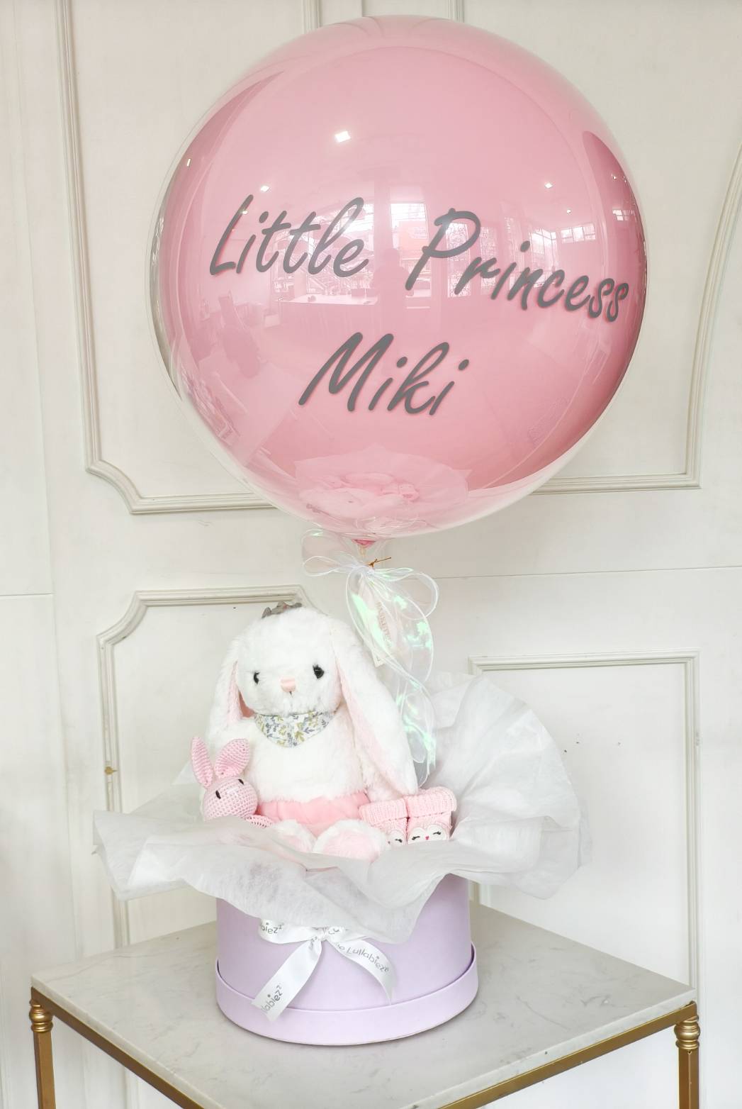 Pink balloon with “Little Princess” text, paired with a bunny plush toy and baby accessories in a pastel gift box.