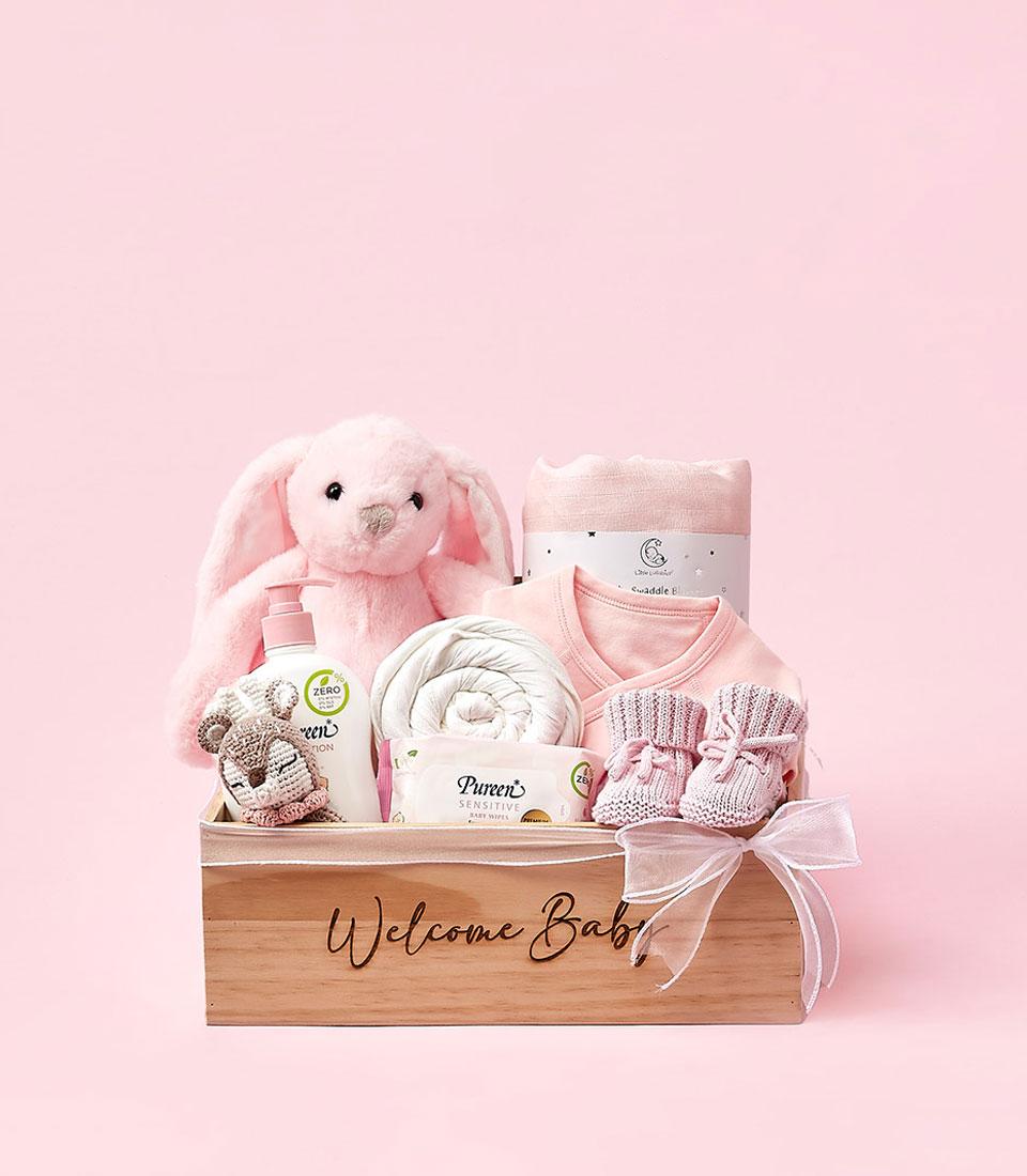 A treasure trove of baby essentials, this wooden box with the text 