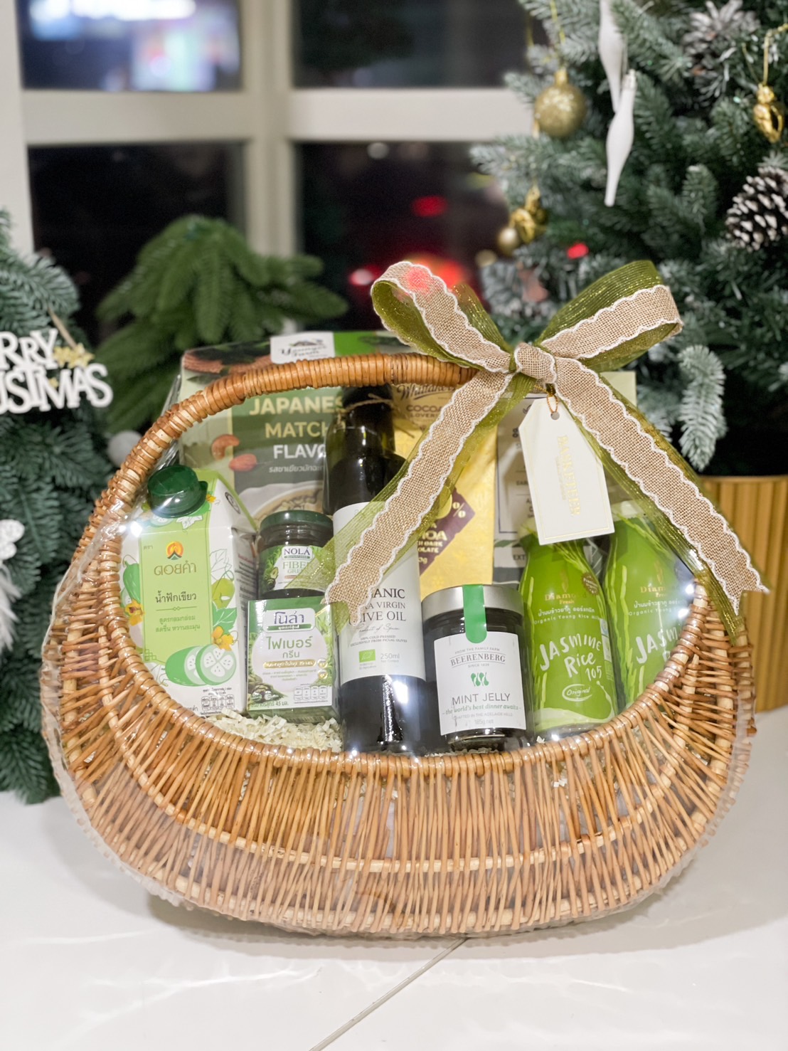 Gift basket with organic olive oil, jasmine rice, matcha treats, and natural health products by Basketeer.