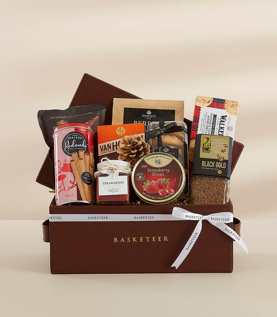 A holiday gift basket featuring a selection of delicious snacks and drinks, perfect for sharing with loved ones.