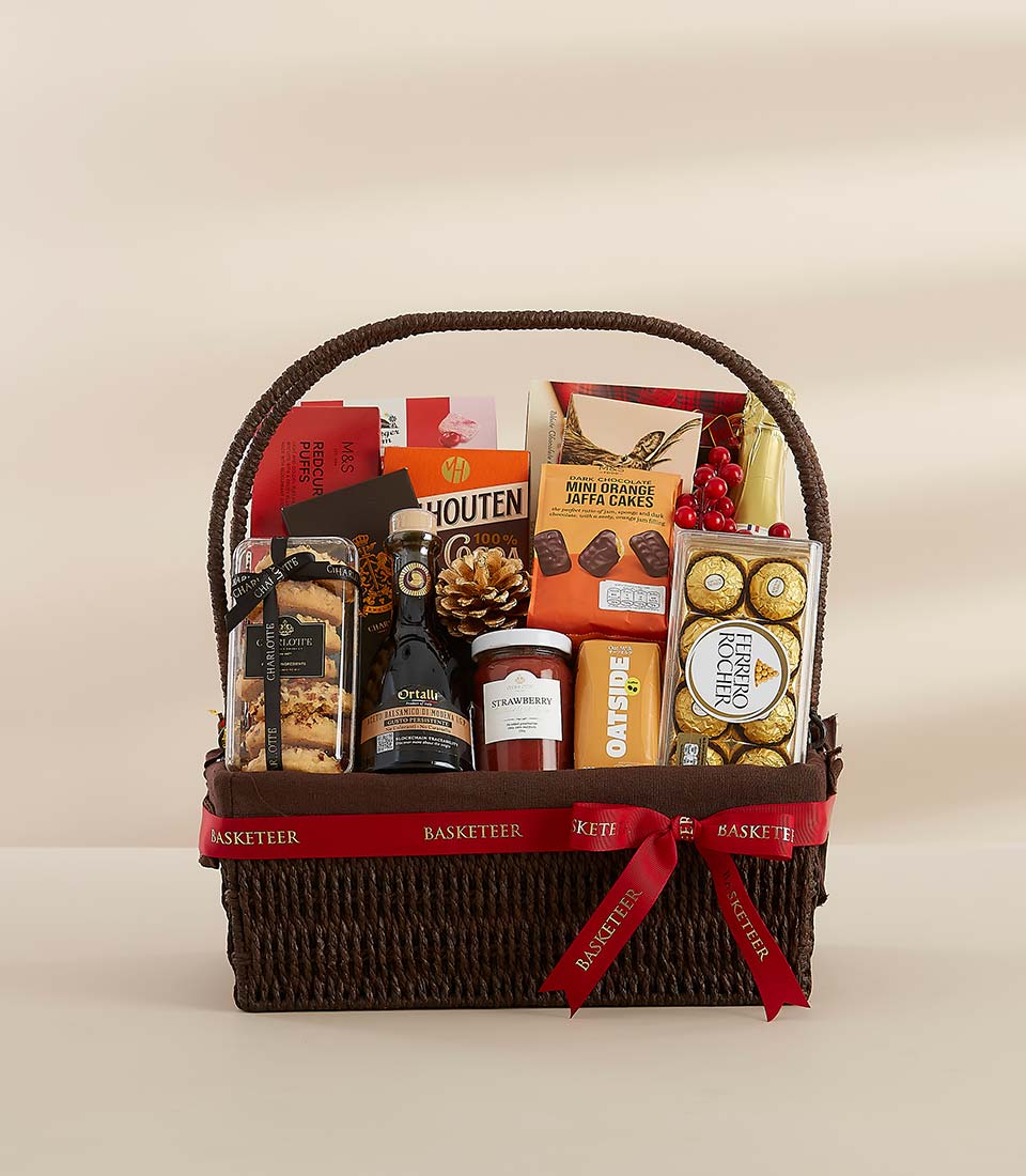 A festive gift basket featuring a selection of sweet and savory treats, perfect for sharing with loved ones.