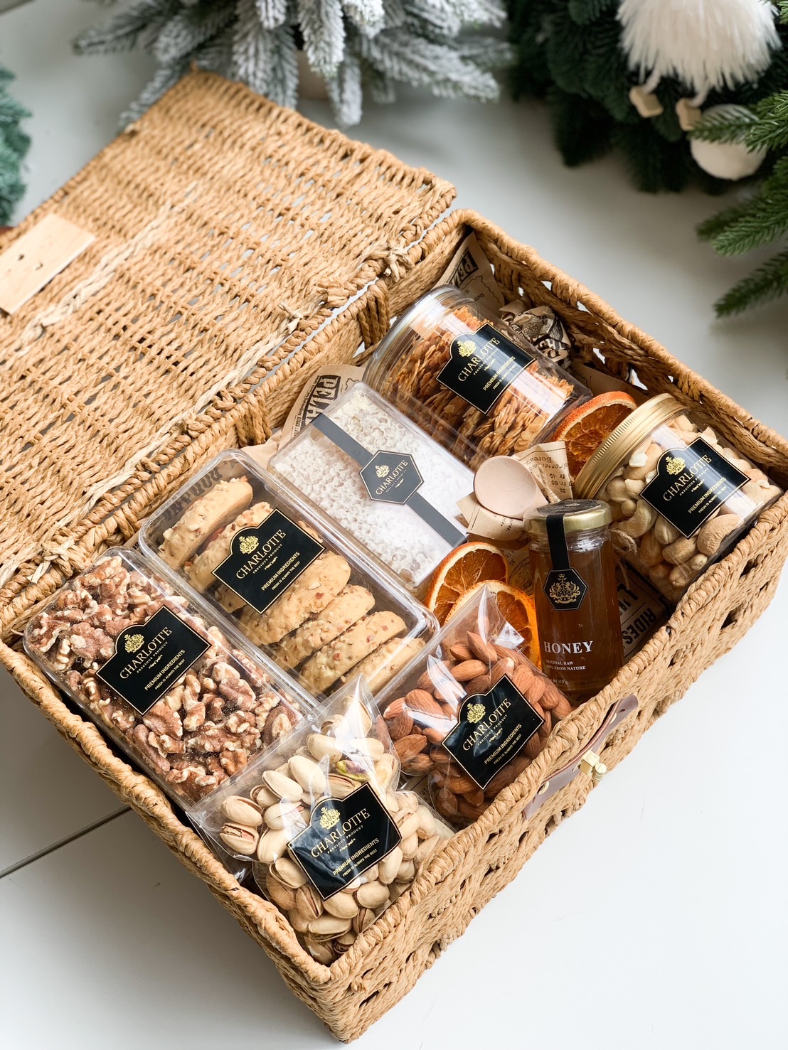 A gift picnic basket with assorted snacks and beverages.