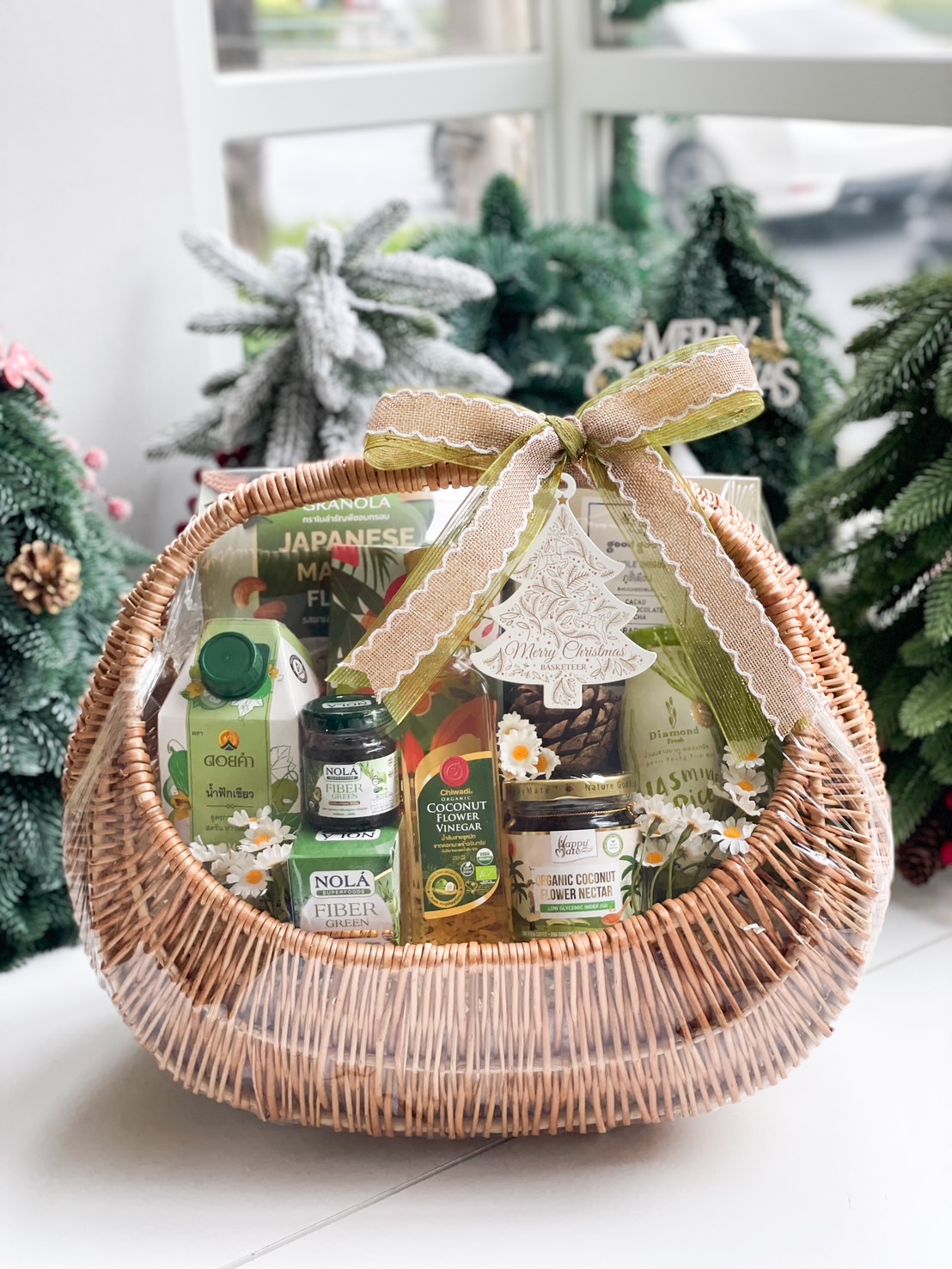 Organic wellness gift basket with jasmine rice, coconut vinegar, matcha granola, and other healthy products.