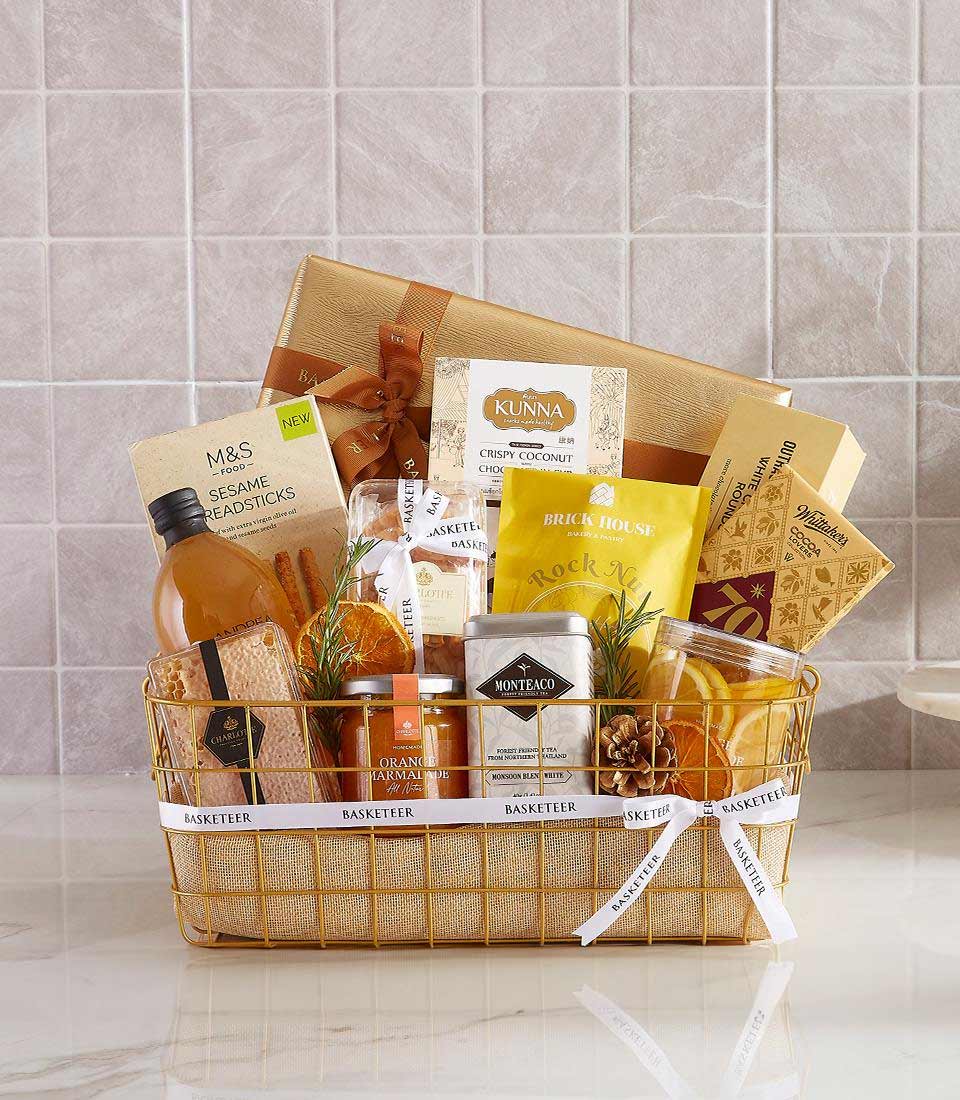 A gift basket with assorted snacks and beverages.