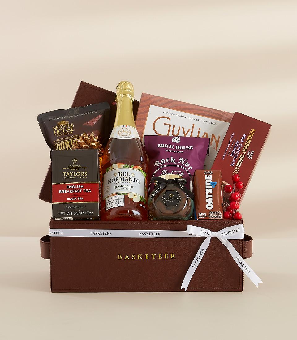 A holiday gift basket containing indulgent food items, perfect for gifting or enjoying yourself.