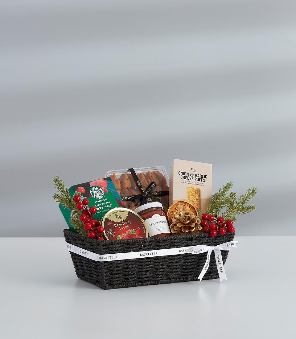 A festive gift basket featuring a selection of sweet , perfect for sharing with loved ones.