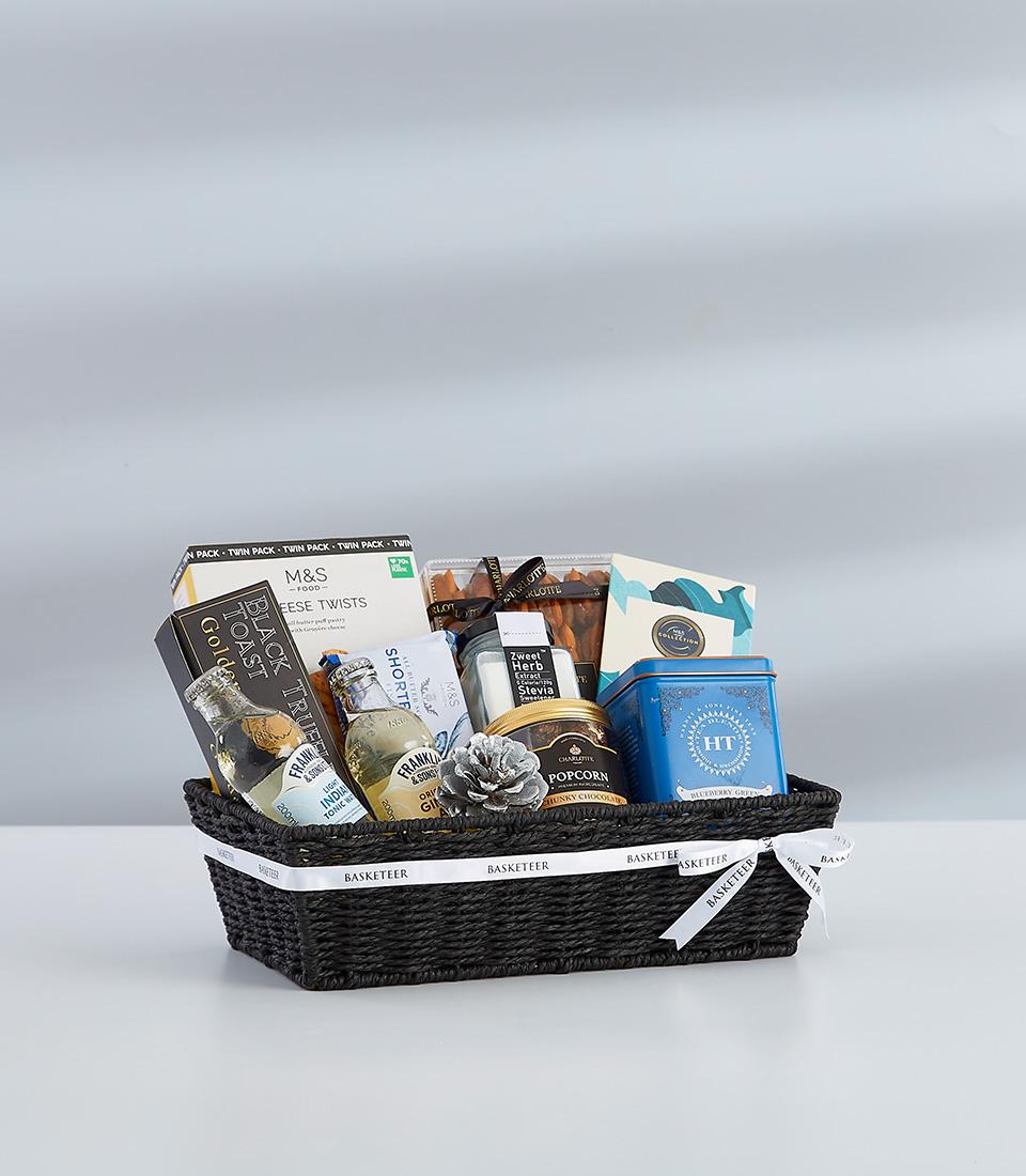 A festive gift basket featuring a selection of sweet, perfect for sharing with loved ones.