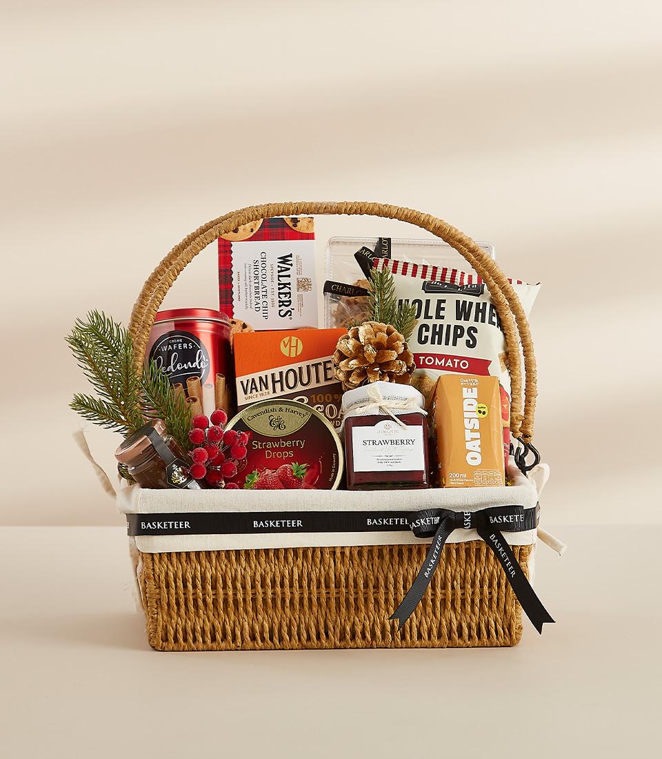 A festive gift basket featuring a selection of sweet , perfect for sharing with loved ones.