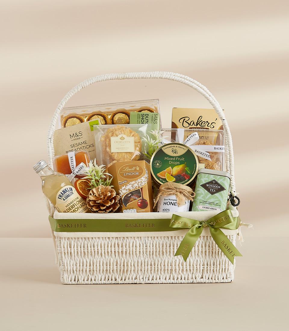 A holiday gift basket containing indulgent food items, perfect for gifting or enjoying yourself.