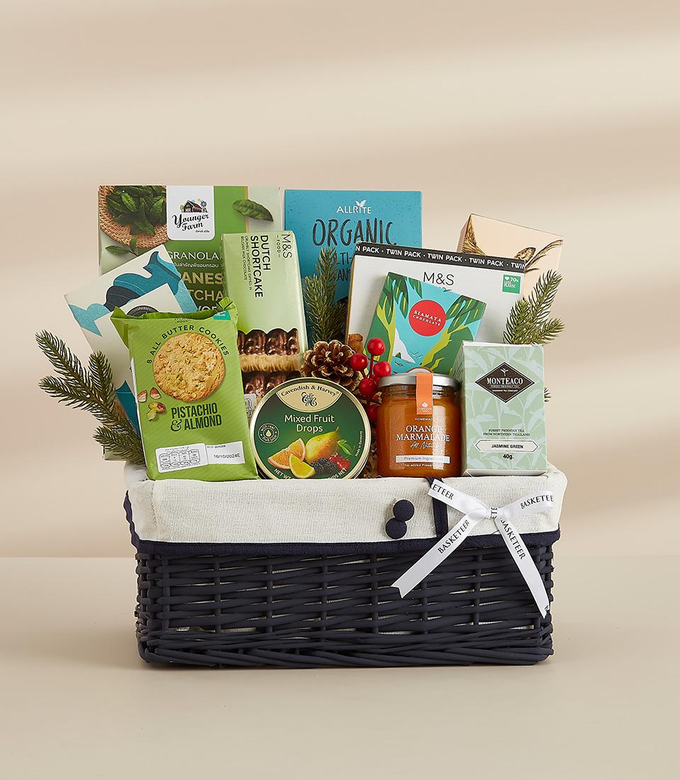 A festive gift basket featuring a selection of sweet , perfect for sharing with loved ones.