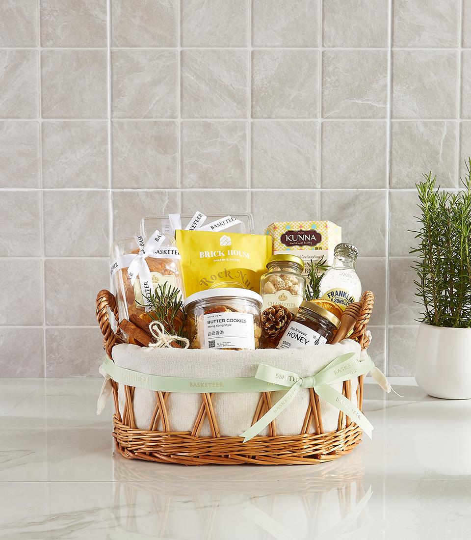 Premium gourmet gift basket with butter cookies, honey, rock sugar, and various treats.
