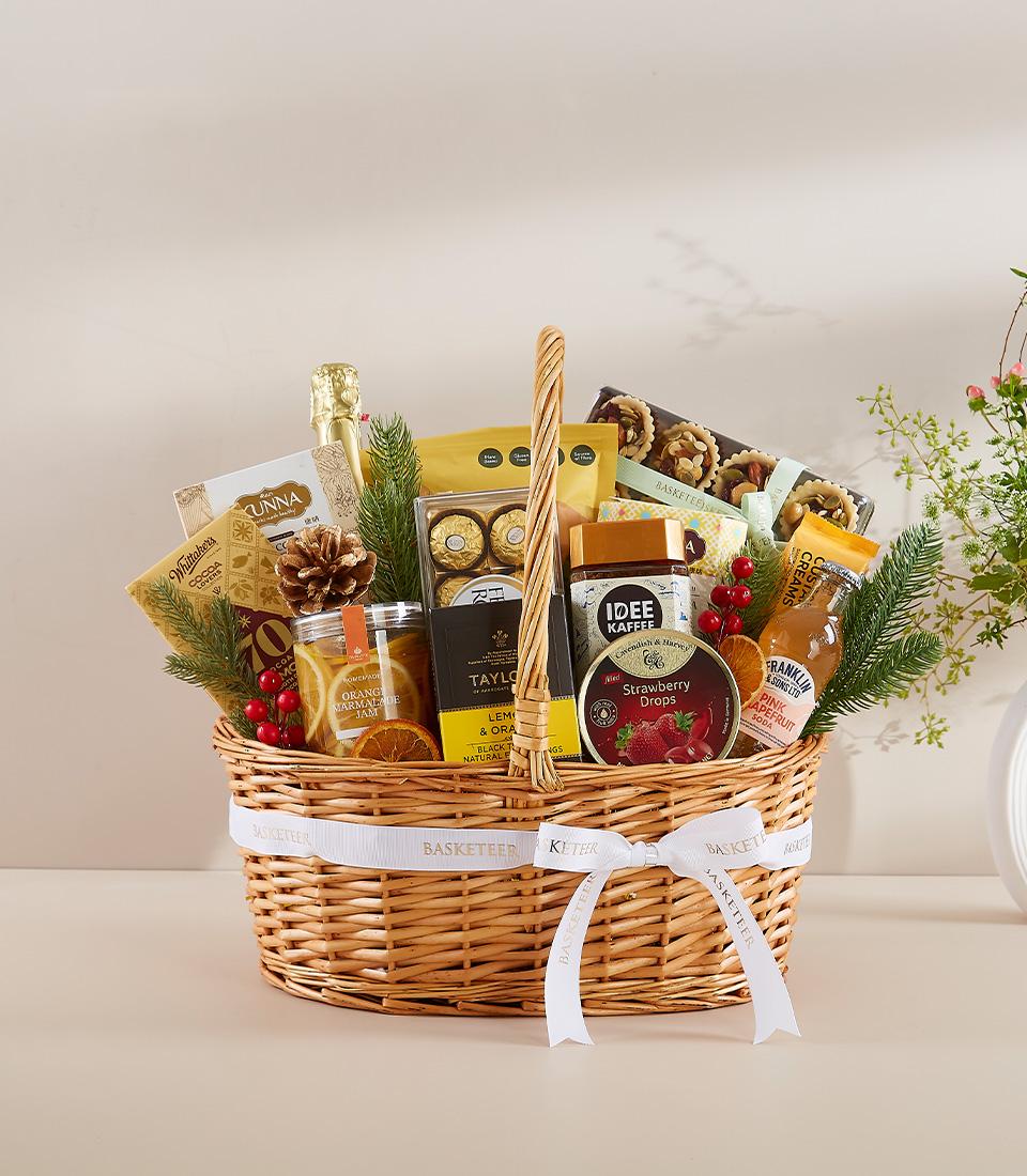 A gift basket with assorted snacks and beverages.