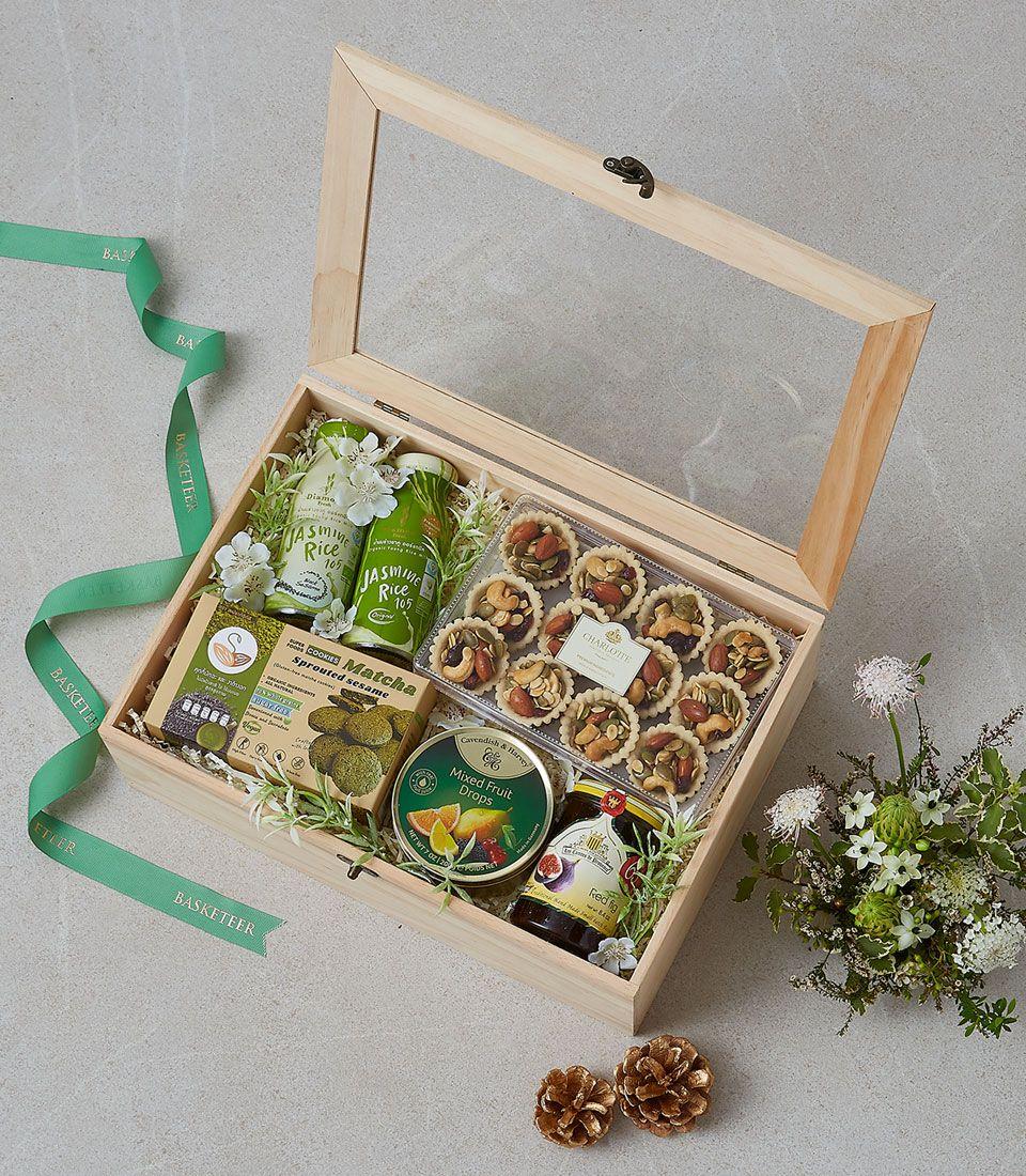 A gift basket with assorted snacks and beverages.