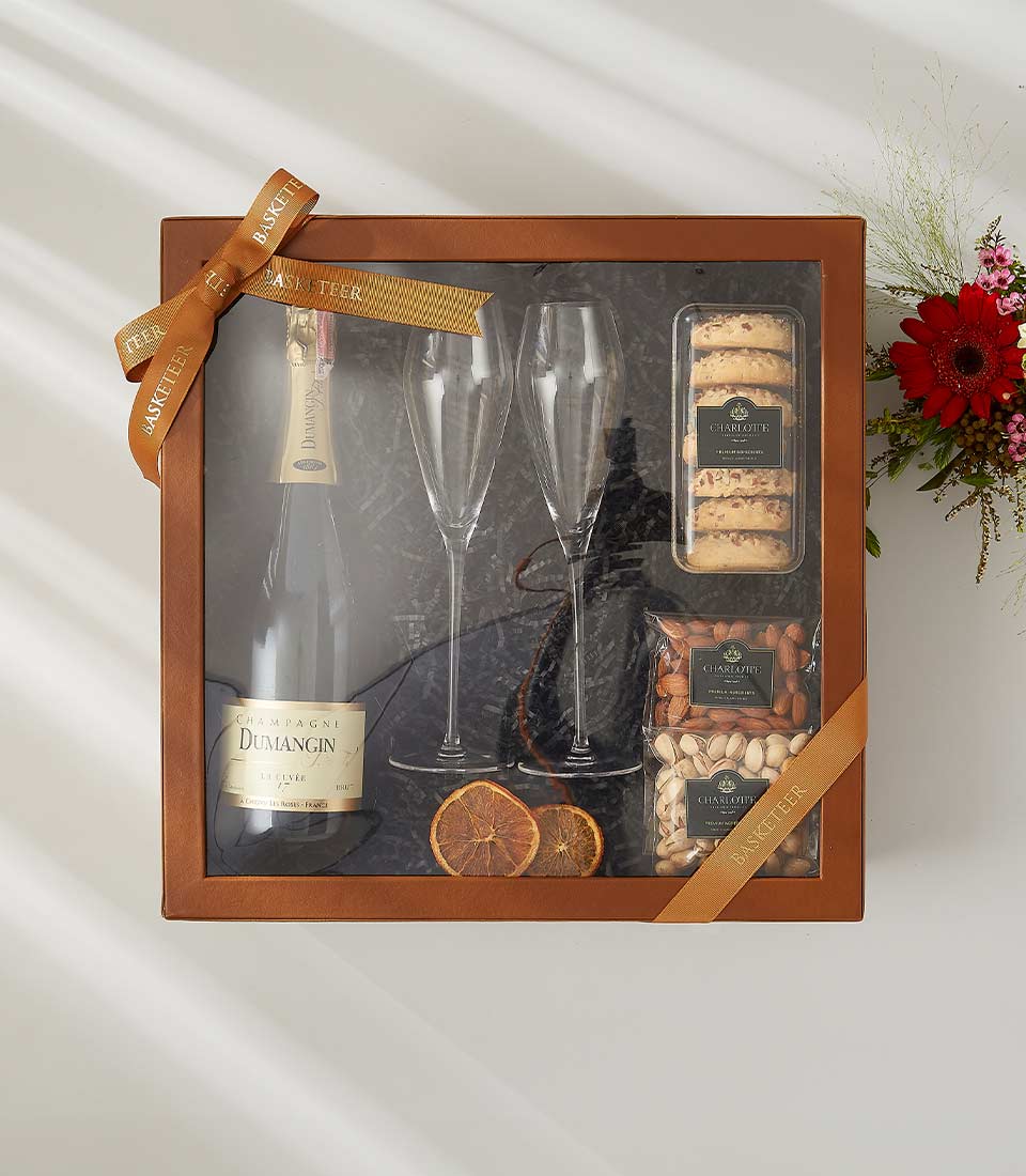 Champagne gift box with Dumangin champagne, crystal flutes, assorted nuts, and cookies With a lid and beautifully tied with a bow.