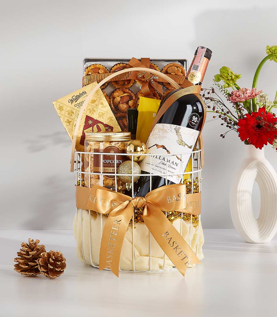 A white wicker basket overflowing with festive goodies, perfect for any occasion.