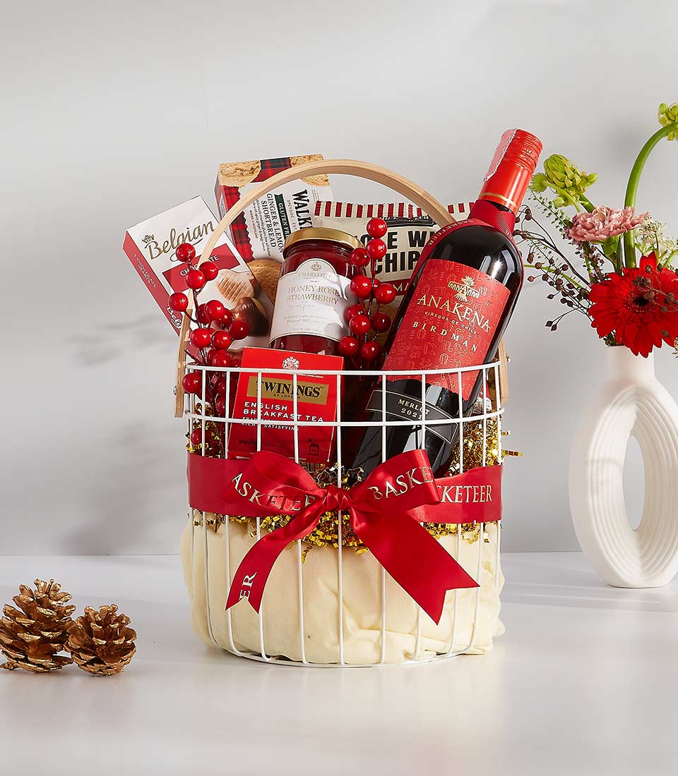 A white wicker basket overflowing with festive goodies, perfect for any occasion.